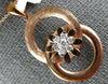 ESTATE .19CT DIAMOND 18KT ROSE GOLD 3D FLOWER CIRCULAR LOVE KNOT FUN PENDANT