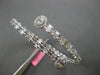 LARGE 5.69CT DIAMOND 18KT WHITE GOLD ROUND & BAGUETTE INVISIBLE BANGLE BRACELET