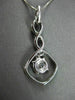 ANTIQUE .67CT ROUND DIAMOND 18KT WHITE GOLD INFINITY FLOATING PENDANT & CHAIN