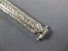 WIDE 4.80CT DIAMOND 18KT WHITE GOLD ROUND & BAGUETTE LOVE KNOT TENNIS BRACELET