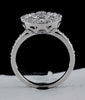ESTATE 1.11CT DIAMOND 18KT WHITE GOLD ROUND & BAGUETTE CIRCULAR FLOWER LOVE RING