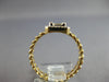 .22CT DIAMOND 14KT YELLOW GOLD ROUND & BAGUETTE INVISIBLE SQUARE LOVE KNOT RING