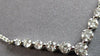 ESTATE .60CT DIAMOND 18KT WHITE GOLD 3D ROUND SHARED PRONG V SHAPE LOVE NECKLACE