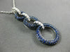 2.16CT DIAMOND & SAPPHIRE 18KT WHITE & BLACK GOLD CIRCULAR JOURNEY LOVE PENDANT