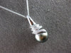 LARGE .07CT DIAMOND & AAA TAHITIAN PEARL 14KT WHITE GOLD SWIRL FLOATING PENDANT