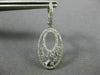 ESTATE .75CT ROUND AND BAGUETTE DIAMOND 14KT WHITE GOLD 3D OVAL HANGING EARRINGS