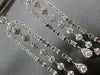 LONG 1.25CT DIAMOND 14KT WHITE GOLD ROUND & BAGUETTE HORSESHOE HANGING EARRINGS
