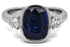 3.28CT DIAMOND & AAA SAPPHIRE 18KT WHITE GOLD CUSHION & ROUND BEZEL 3 STONE RING