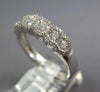 ESTATE .90CT DIAMOND 18KT WHITE GOLD 3D CLASSIC 7 STONE HALO ANNIVERSARY RING