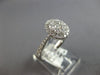 .82CT DIAMOND 18KT WHITE GOLD 3D CLASSIC ROUND CLUSTER HALO OVAL FRIENDSHIP RING