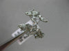 ESTATE WIDE 18KT WHITE GOLD LOVE RING. 3D MULTI LEAF CRISS CROSS DESIGN