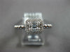 ESTATE .27CT DIAMOND 18KT WHITE GOLD ROUND & BAGUETTE INVISIBLE HALO BEADED RING
