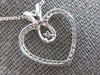 .25CT DIAMOND 14KT WHITE GOLD 3D OPEN HEART INFINITY SOLITAIRE FLOATING PENDANT