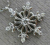 ESTATE .16CT DIAMOND 14KT WHITE GOLD 3D SNOWFLAKE FLOATING LOVE PENDANT