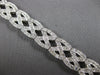 WIDE 4.20CT DIAMOND 14KT WHITE GOLD ROUND CRISS CROSS INFINITY TENNIS BRACELET