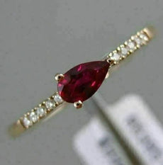 .34CT ROUND DIAMOND & AAA PEAR SHAPE RUBY 14KT ROSE GOLD FRIENDSHIP PROMISE RING