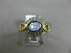ESTATE .92CT DIAMOND & AAA OVAL TANZANITE 14KT YELLOW GOLD SEMI BEZEL LOVE RING