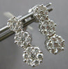 1.0CT DIAMOND 14KT WHITE GOLD 3D MULTI FLOWER JOURNEY SCREWBACK HANGING EARRINGS