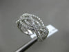 ESTATE WIDE .80CT DIAMOND 18K WHITE GOLD CRISS CROSS SEMI ETERNITY INFINITY RING