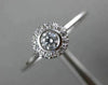 ESTATE .15CT DIAMOND 18KT WHITE GOLD CLASSIC FLOWER HALO BEZEL FRIENDSHIP RING