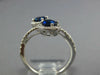 WIDE 1.23CT DIAMOND & AAA SAPPHIRE 18KT WHITE GOLD OVAL & ROUND CRISS CROSS RING