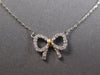 ESTATE SMALL .07CT DIAMOND 14KT WHITE & YELLOW GOLD 3D CLASSIC BOW LOVE NECKLACE