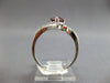 1.18CT DIAMOND & AAA GARNET 14KT WHITE GOLD PEAR SHAPE & ROUND CRISS CROSS RING