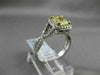 ESTATE 1.82CTW GIA FANCY YELLOW DIAMOND 18KT WHITE GOLD HALO ENGAGEMENT RING
