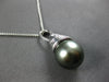 LARGE .07CT DIAMOND & AAA TAHITIAN PEARL 14KT WHITE GOLD SWIRL FLOATING PENDANT