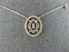 ESTATE .41CT DIAMOND 14KT WHITE AND ROSE GOLD 3D OVAL BY THE YARD LOVE PENDANT
