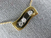 ESTATE .17CT DIAMOND 18KT WHITE & ROSE GOLD 3 STONE ETOILE FLOATING LOVE PENDANT