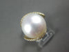 LARGE .32CT DIAMOND & AAA SOUTH SEA PEARL 18KT YELLOW GOLD CRISS CROSS LOVE RING