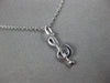 ESTATE .06CT DIAMOND 14KT WHITE GOLD CLASSIC MUSICAL NOTE FUN FLOATING PENDANT