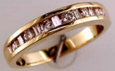 ESTATE .50CT DIAMOND 14KT YELLOW GOLD ROUND & BAGUETTE CHANNEL ANNIVERSARY RING