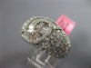 LARGE 5.12CT DIAMOND 18KT WHITE GOLD ROUND & BAGUETTE CRISS CROSS INFINITY RING