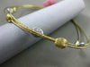 ESTATE .42CT DIAMOND 14KT TWO TONE GOLD HAMMERED BY THE YARD BANGLE BRACELET