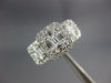 ESTATE WIDE .86CT DIAMOND 18K WHITE GOLD ROUND & BAGUETTE CLUSTER HALO LOVE RING