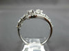 ESTATE .83CT DIAMOND 14KT WHITE GOLD 3D ROUND & BAGUETTE CRISS CROSS FUN RING
