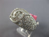 LARGE 5.12CT DIAMOND 18KT WHITE GOLD ROUND & BAGUETTE CRISS CROSS INFINITY RING