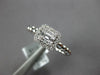 ESTATE .27CT DIAMOND 18KT WHITE GOLD ROUND & BAGUETTE INVISIBLE HALO BEADED RING