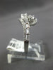 ESTATE .83CT DIAMOND 14KT WHITE GOLD 3D ROUND & BAGUETTE CRISS CROSS FUN RING