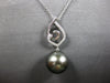 ESTATE LARGE. 15CT DIAMOND & AAA TAHITIAN PEARL 18K WHITE GOLD LOVE KNOT PENDANT