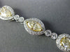 ESTATE LONG 6.23CT WHITE & FANCY YELLOW DIAMOND 18KT WHITE GOLD TENNIS BRACELET