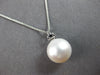 .06CT DIAMOND & AAA SOUTH SEA PEARL 14KT WHITE GOLD FLOWER TRILLION FUN PENDANT