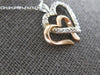 ESTATE .06CT DIAMOND 14KT WHITE & ROSE GOLD DOUBLE HEART LOVE FLOATING PENDANT