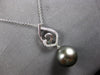 ESTATE LARGE. 15CT DIAMOND & AAA TAHITIAN PEARL 18K WHITE GOLD LOVE KNOT PENDANT