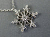 ESTATE .16CT DIAMOND 14KT WHITE GOLD 3D SNOWFLAKE FLOATING LOVE PENDANT