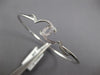 ESTATE .26CT DIAMOND 14KT WHITE GOLD 3D DOUBLE HEART LOVE KNOT BANGLE BRACELET