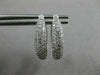 ESTATE .71CT DIAMOND 18KT WHITE GOLD CLASSIC ELONGATED PAVE OVAL HUGGIE EARRINGS