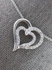 ESTATE .24CT DIAMOND 14KT WHITE GOLD CLASSIC DOUBLE HEART LOVE FLOATING PENDANT